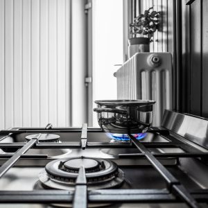 A small metal pan on the stove in the kitchen